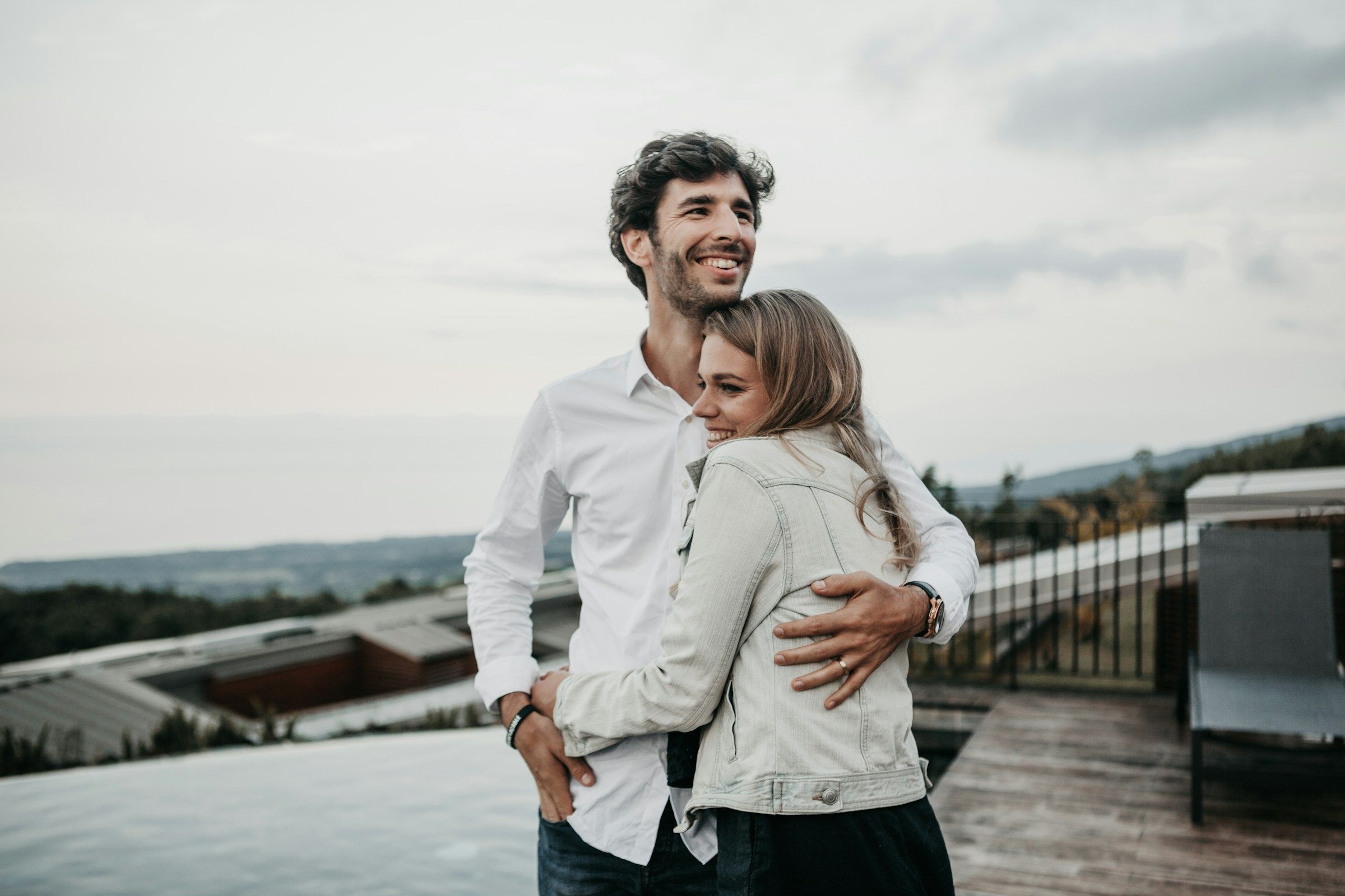 A man and woman hugging each other
