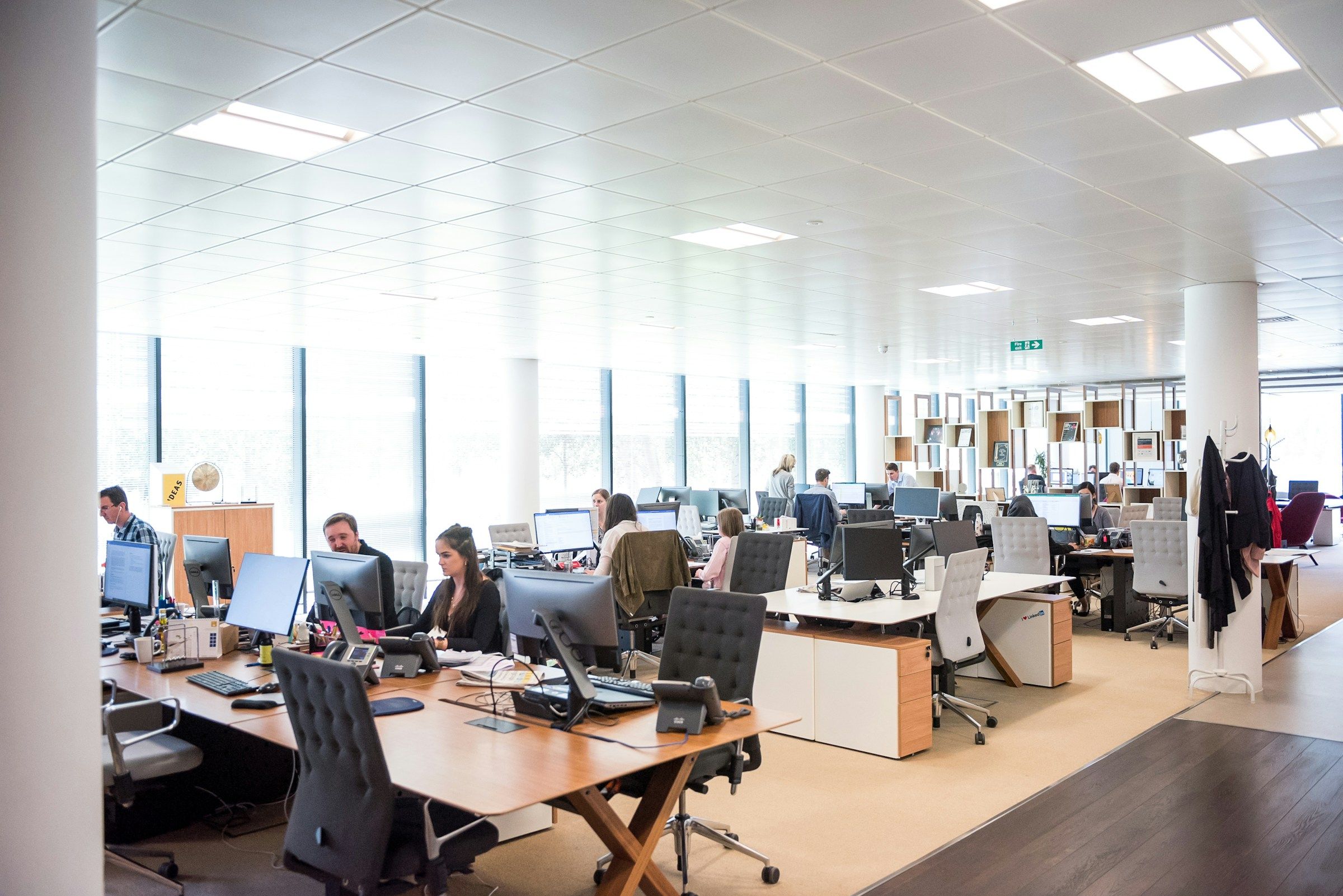 People working at desks in an open office