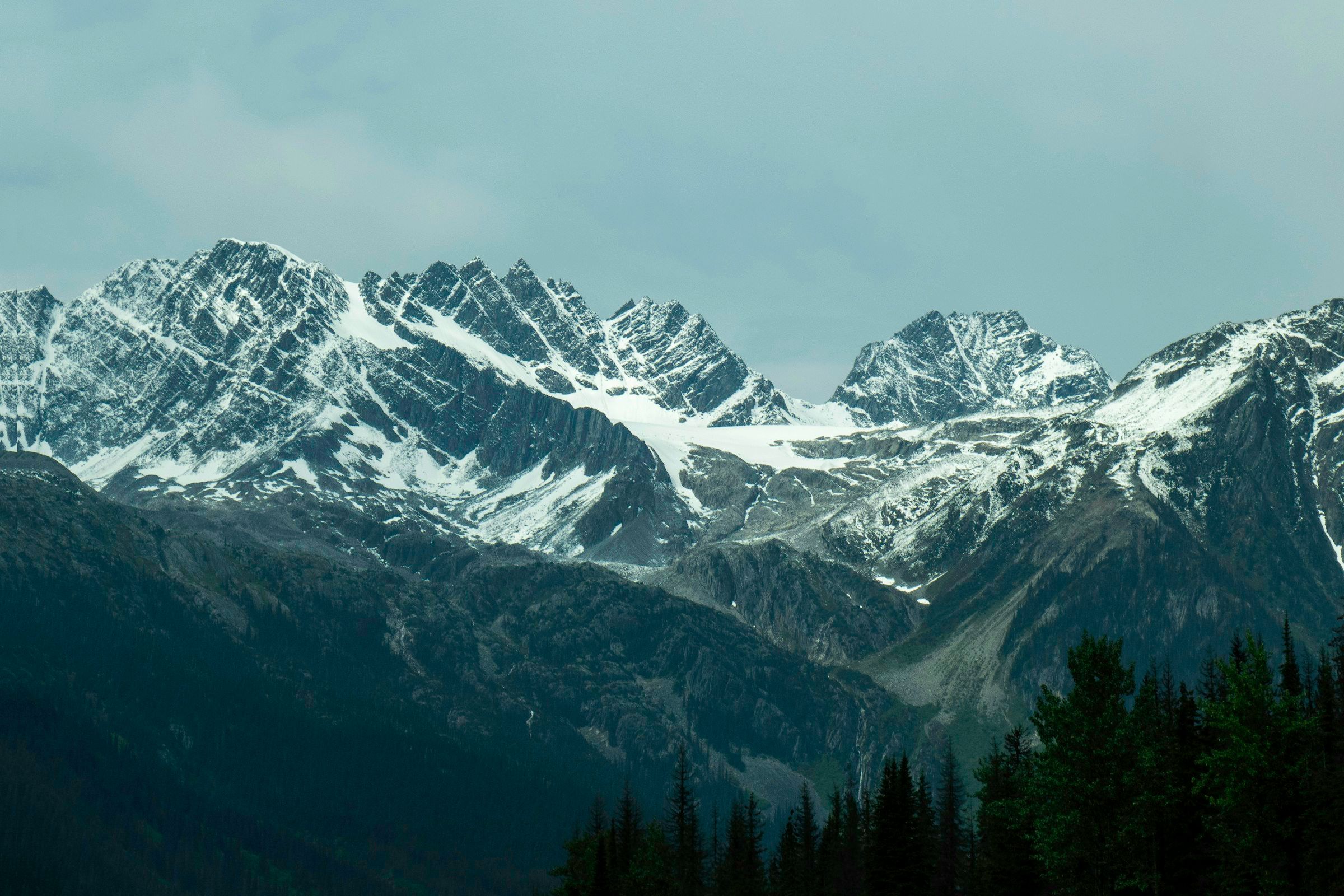 Snow-covered mountains and evergreen forest at Rogers Pass in British Columbia