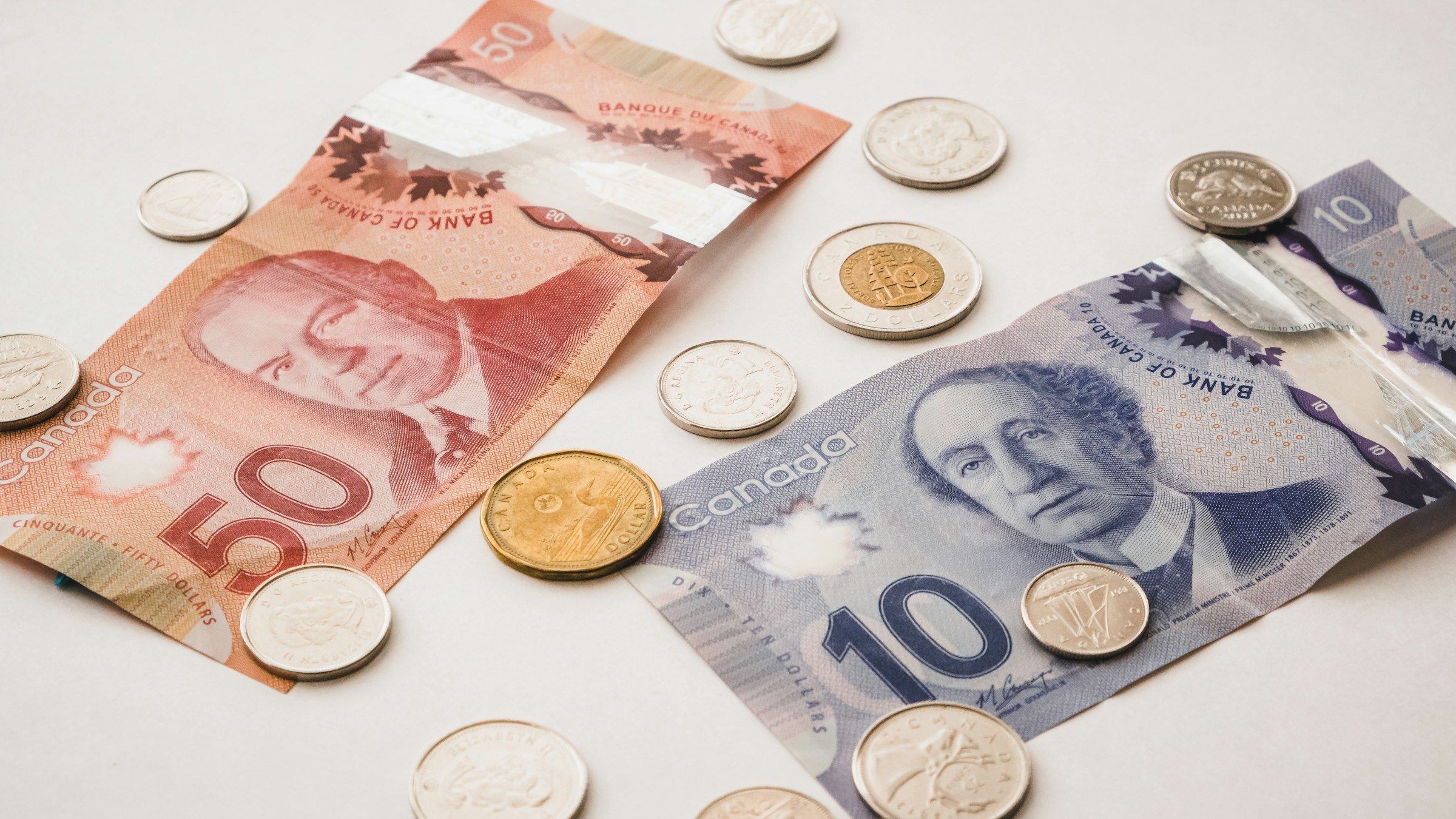 Canadian bills and coins on a table