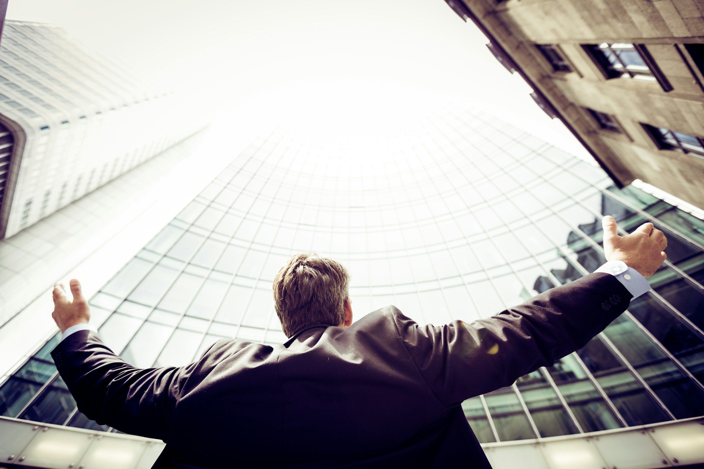 Man standing among tall buildings
