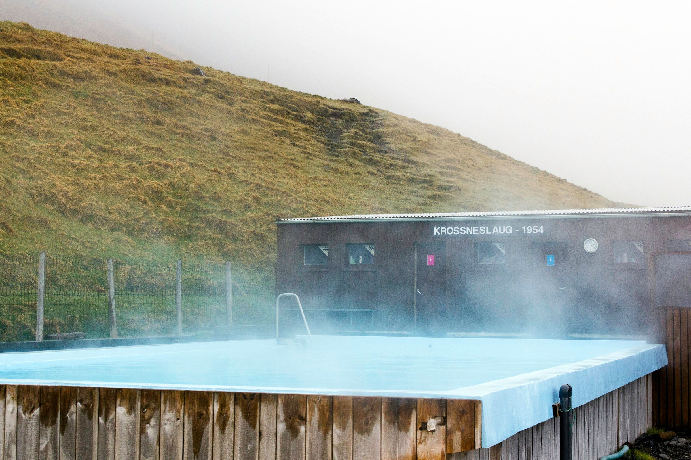 Steam rising from an outdoor hot tub in cold weather