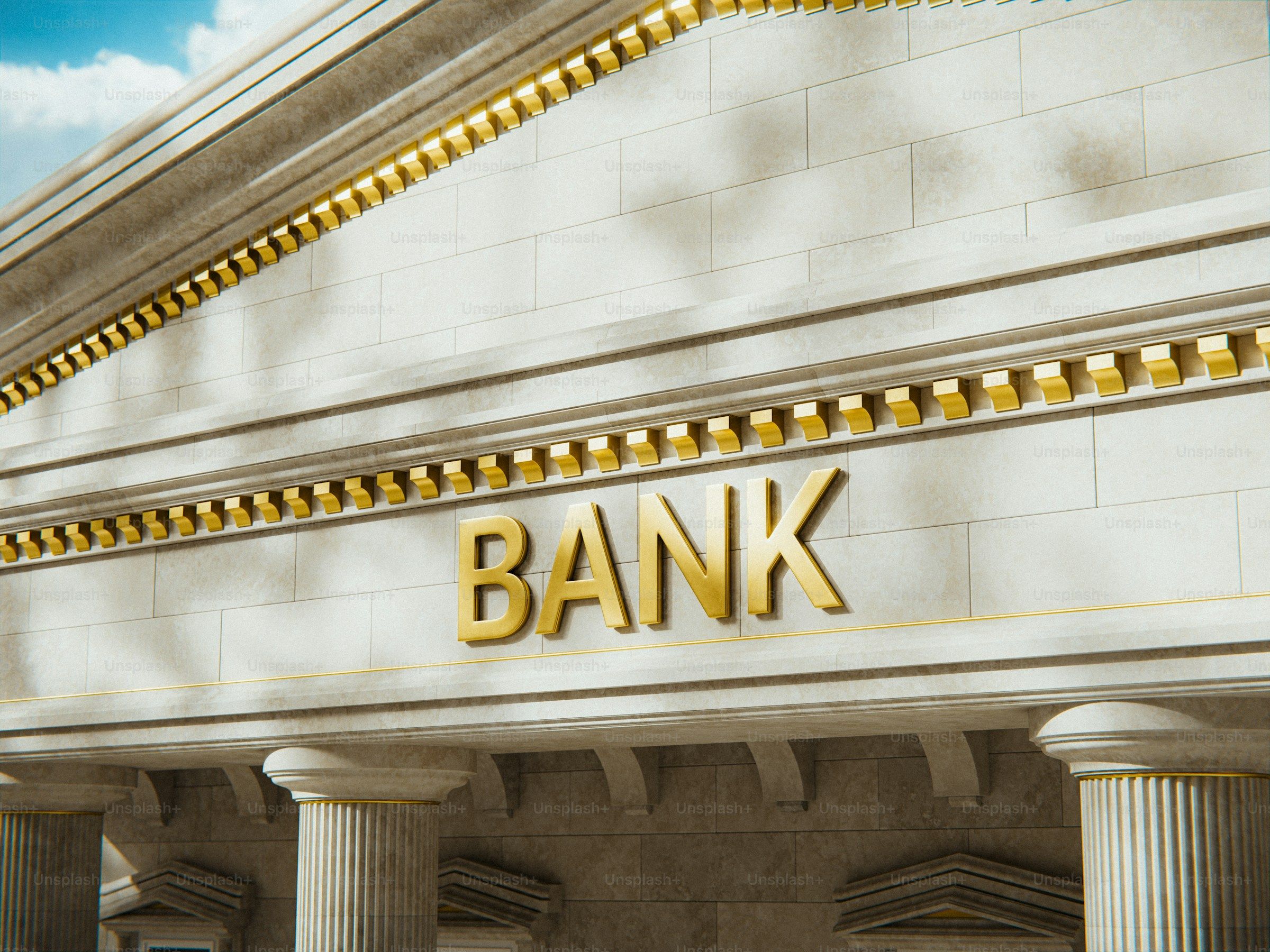 A bank building with gold lettering and stone columns